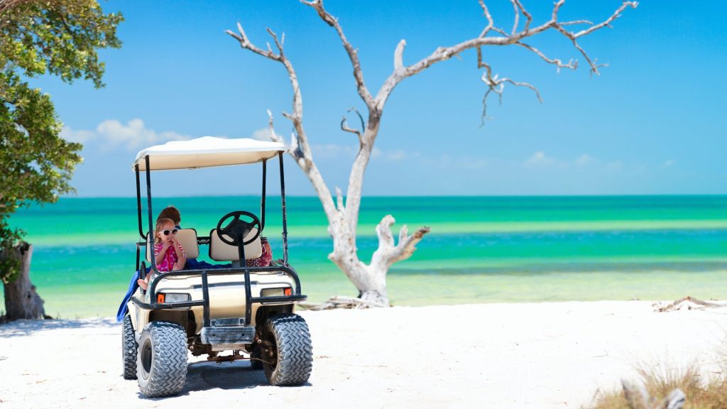 Golf cart on a beach.